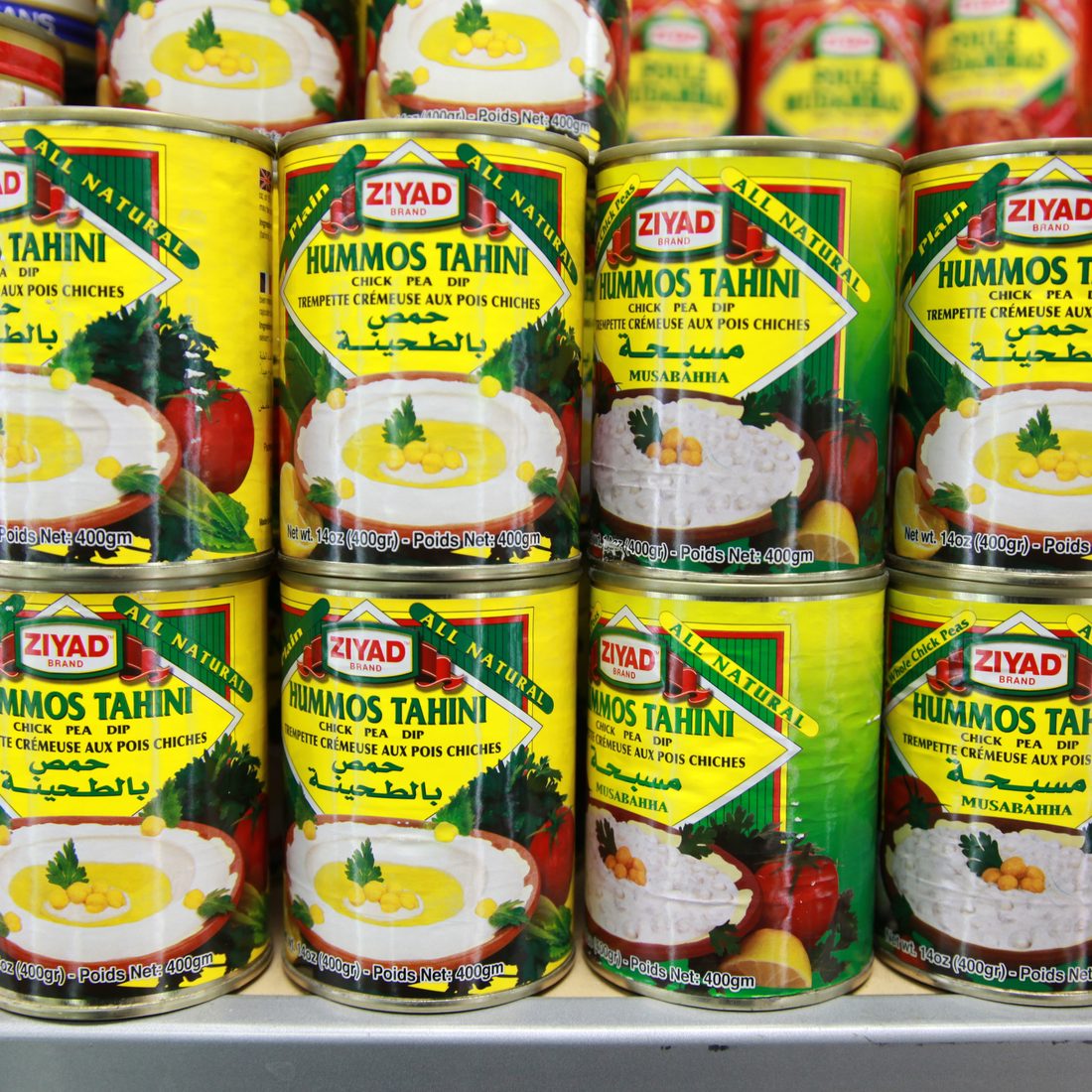 Wall of hummus tahini cans
